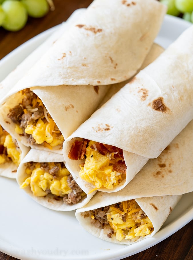 plate of breakfast burritos with bacon and sausage