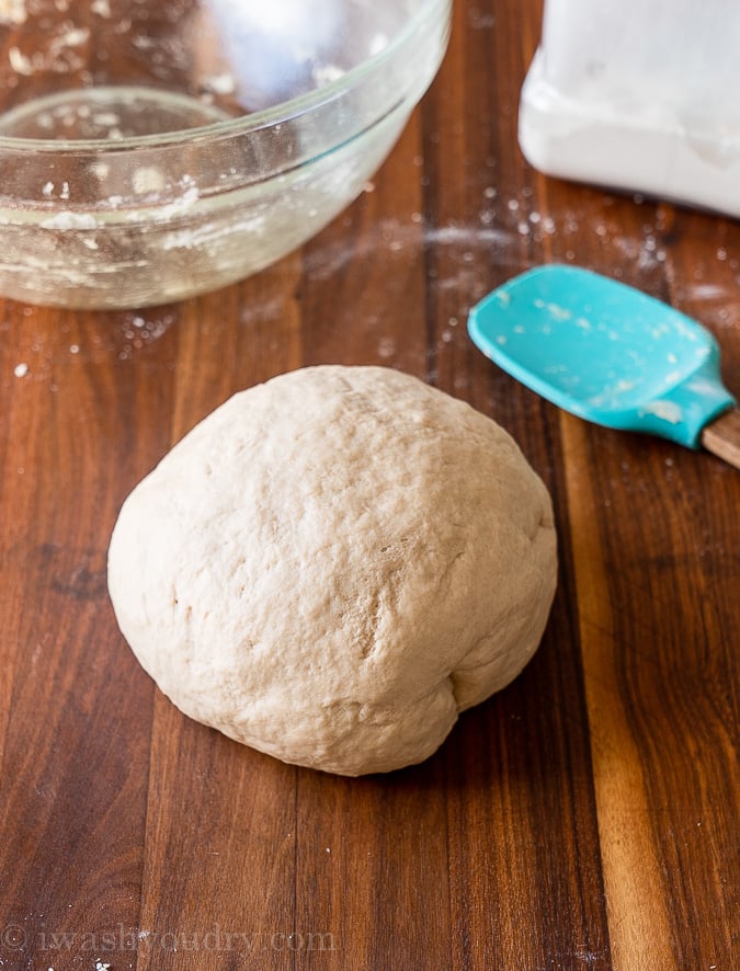 naan dough ball on wood surface