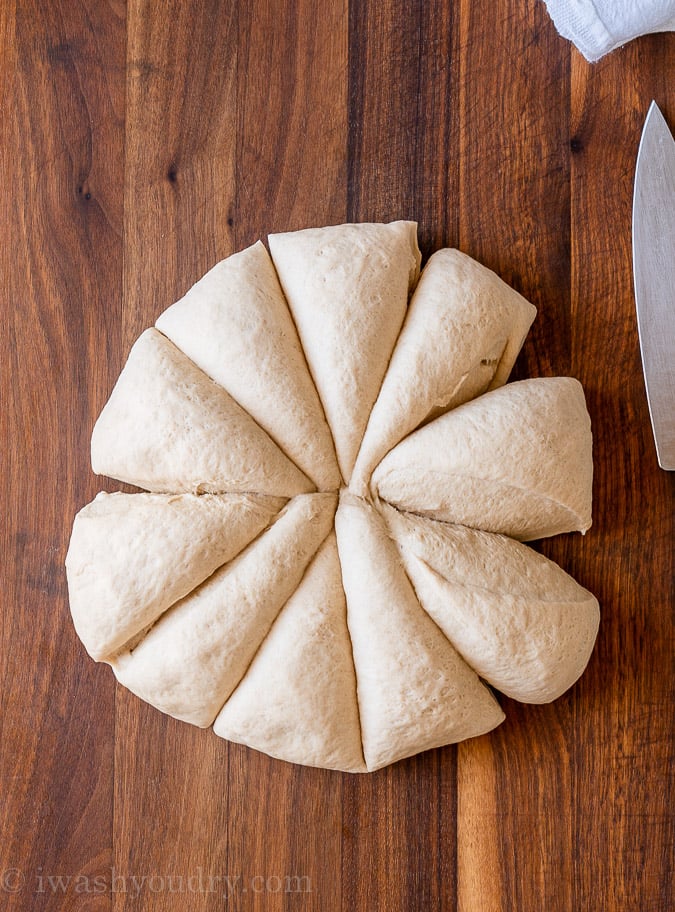 naan dough divided into wedges