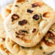 pile of soft naan bread on plate
