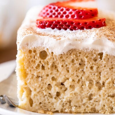 Tres Leches Cake recipe with whipped cream and strawberries