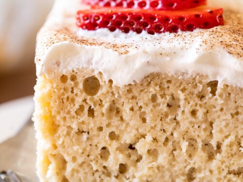 Tres Leches Cake recipe with whipped cream and strawberries