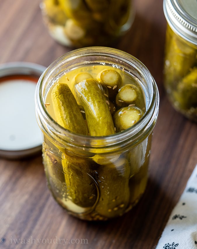 jar with dill pickles open on counter