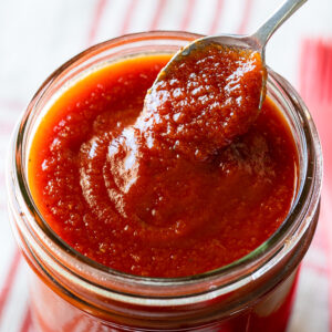 homemade honey bbq sauce in jar with spoon