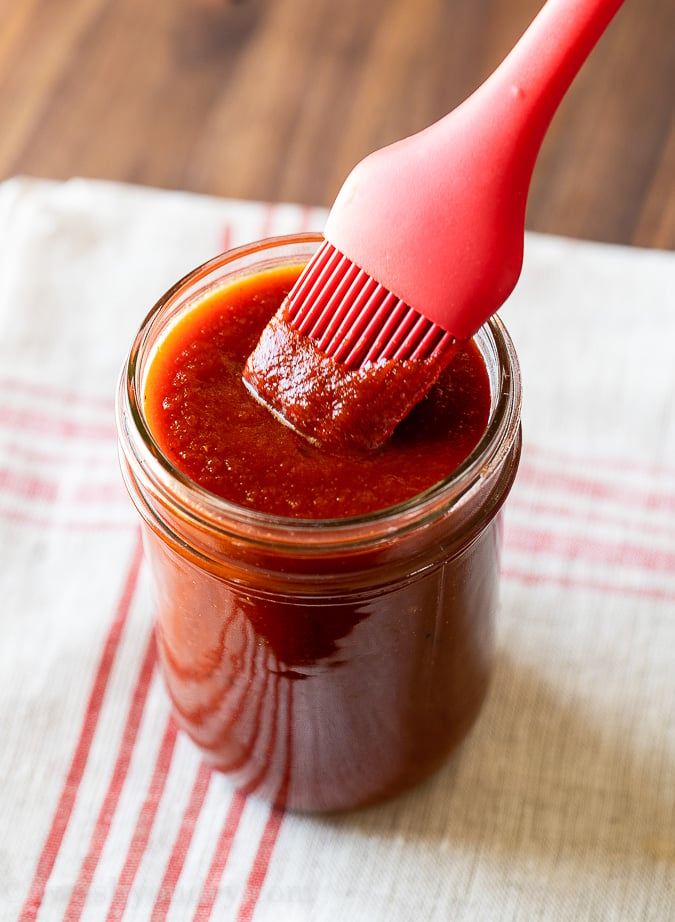 bbq sauce in jar with brush