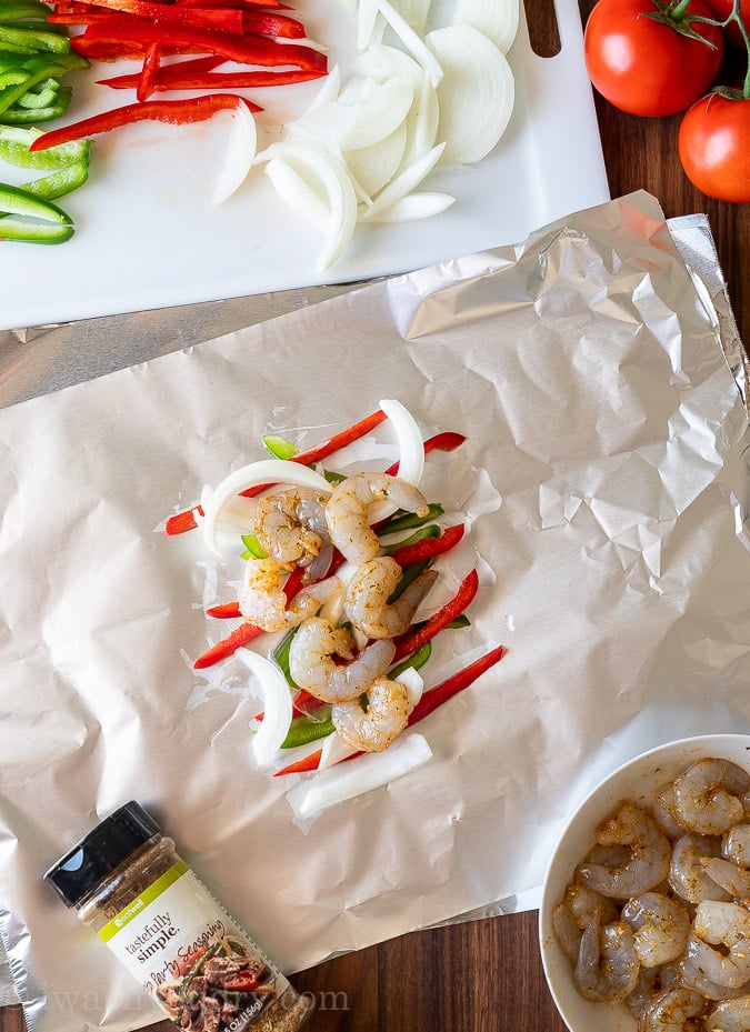 arrange shrimp and peppers on foil sheet