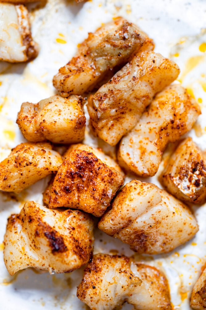 seasoned white fish on tray