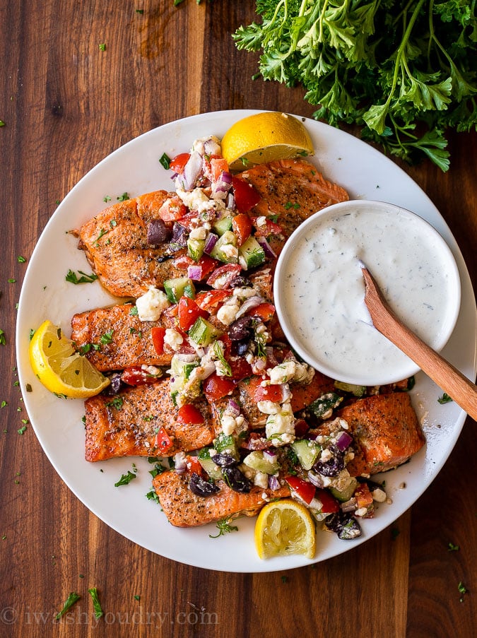 easy grilled salmon recipe with fresh greek salsa on top and side of tzatziki sauce