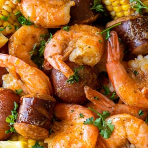 closeup of shrimp boil recipe with potatoes sausage and corn
