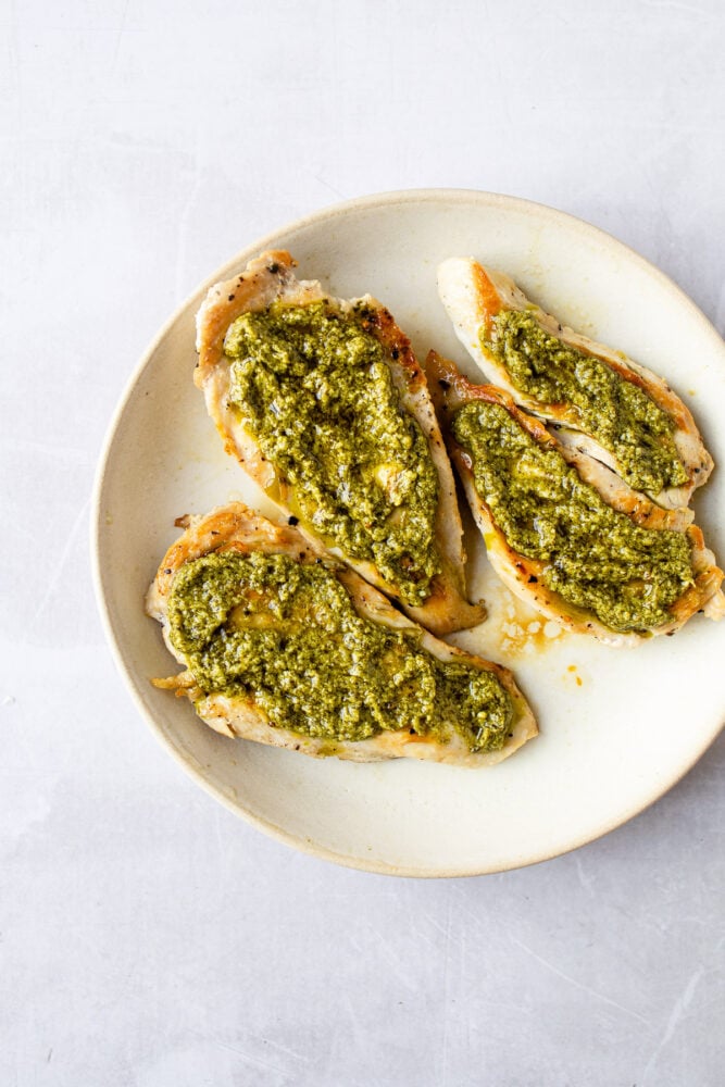 sear chicken then top with basil pesto