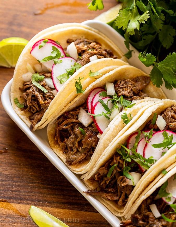 slow cooker barbacoa beef in taco shells with radish