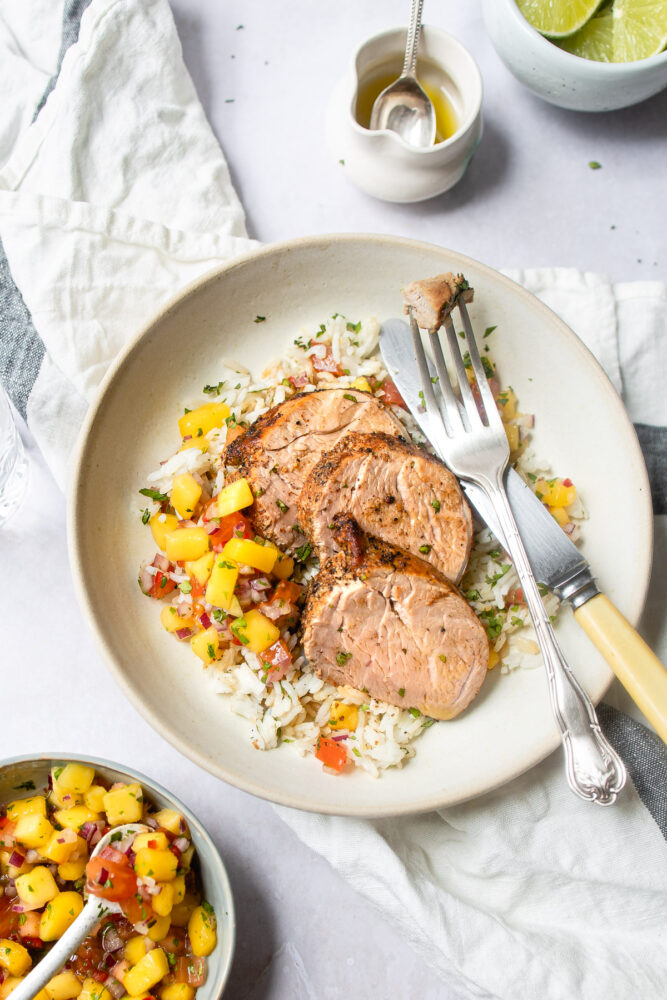 plate of pork tenderloin with fork