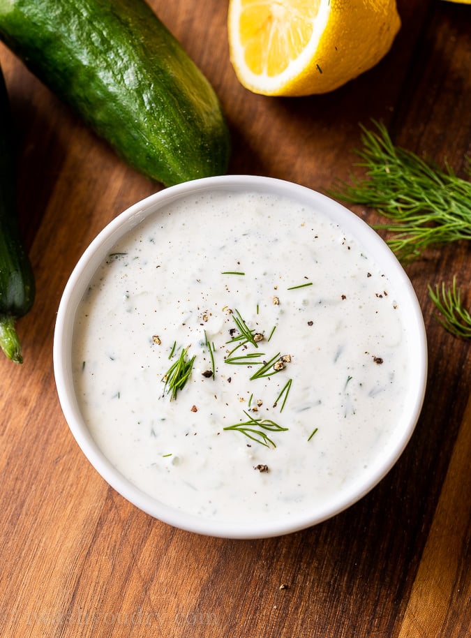 easy creamy Greek Tzatziki Sauce in bowl with fresh dill