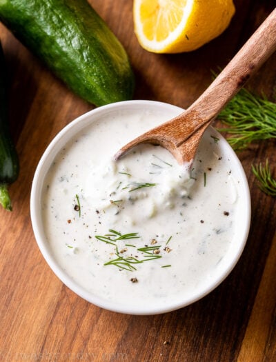 bowl of creamy greek tzatziki sauce with cucumbers and dill