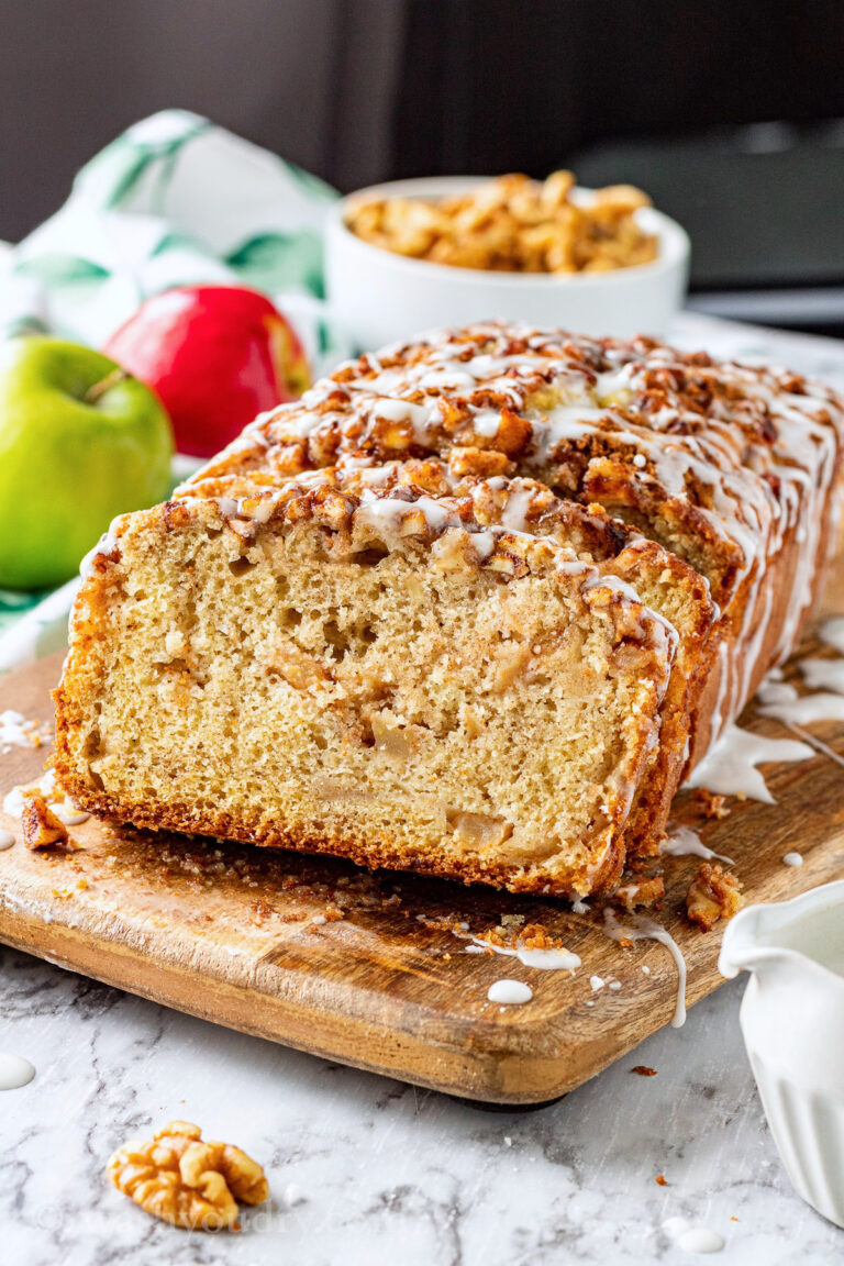 Slices of apple fritter bread on wood cutting board