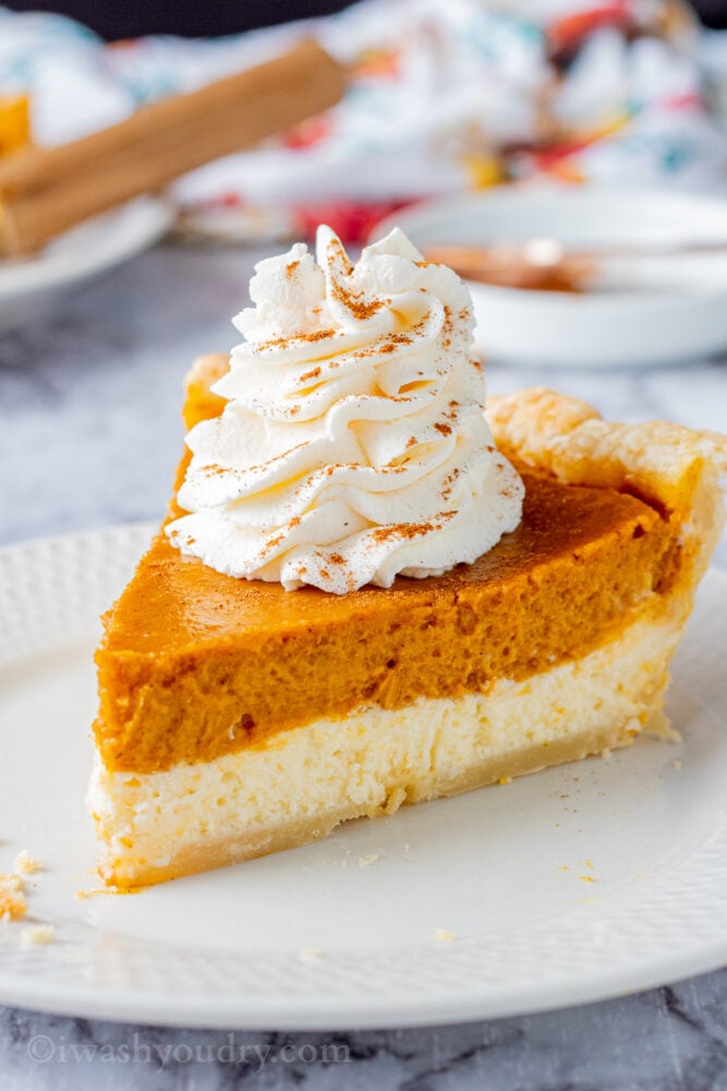 Slice of Pumpkin cheesecake pie on white plate.