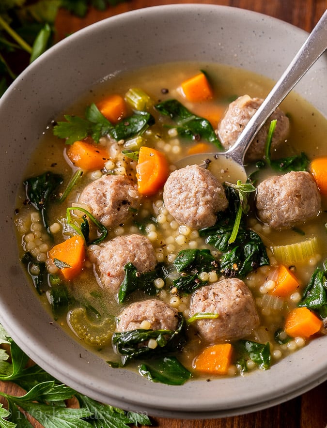 bowl of soup with tiny pasta and italian sausage.