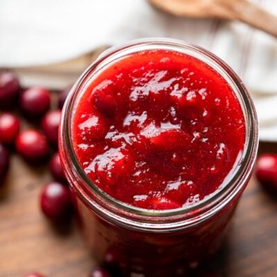cranberry sauce in a jar with spoon