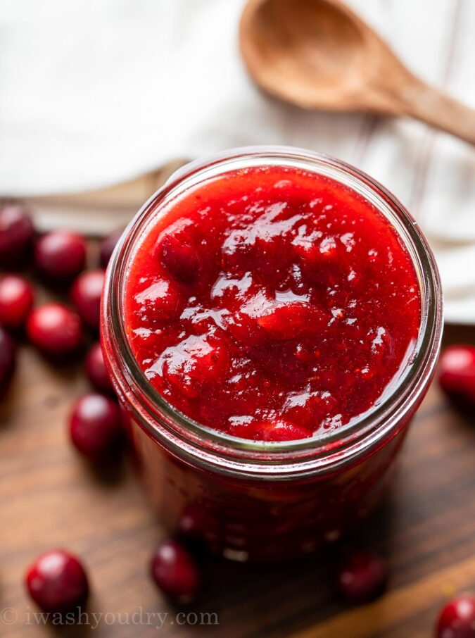 cranberry sauce in a jar with spoon