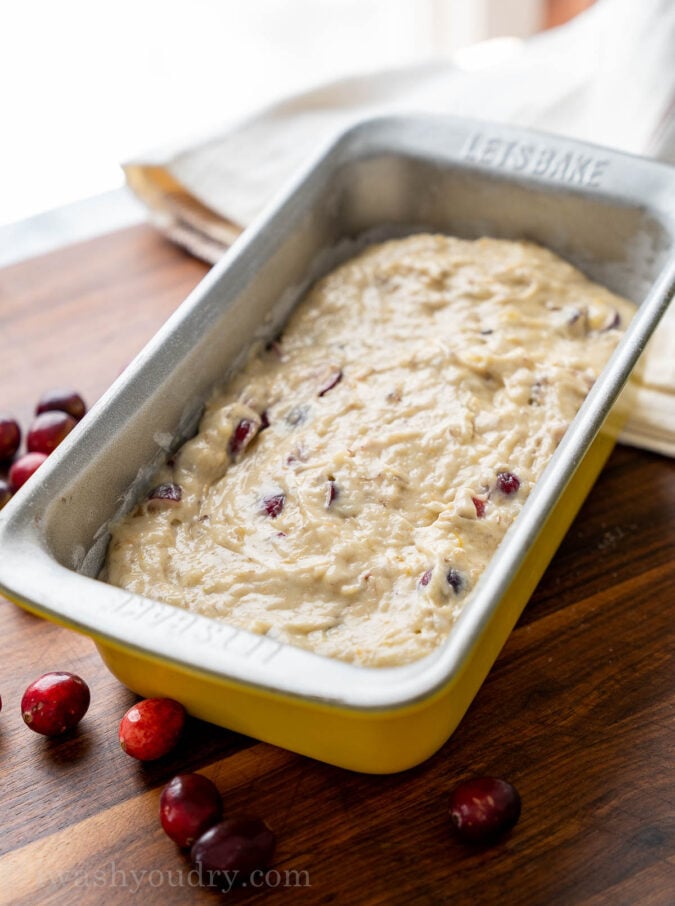 Banana bread batter in pan with cranberries