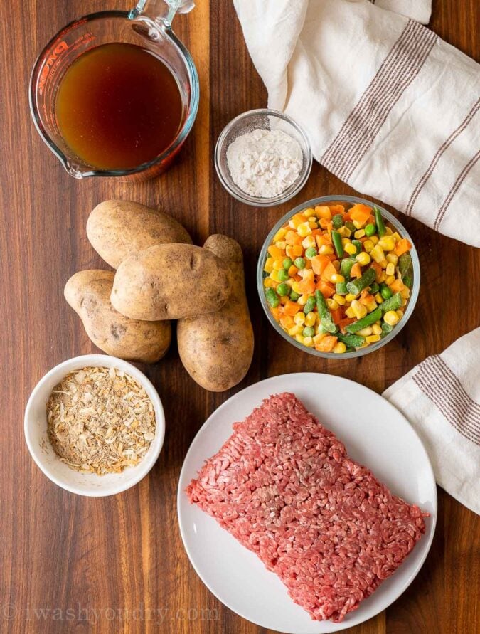 ingredients on wooden table with ground beef