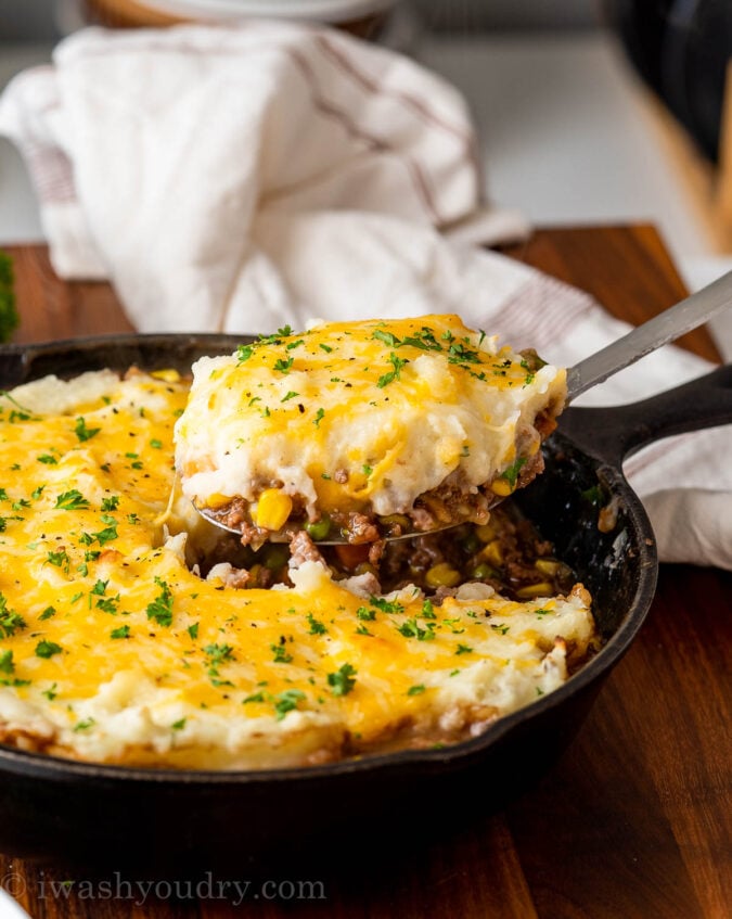 spoonful of shepherd's pie lifting out of pan