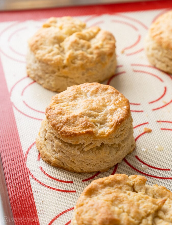 freshly baked biscuits on baking sheet