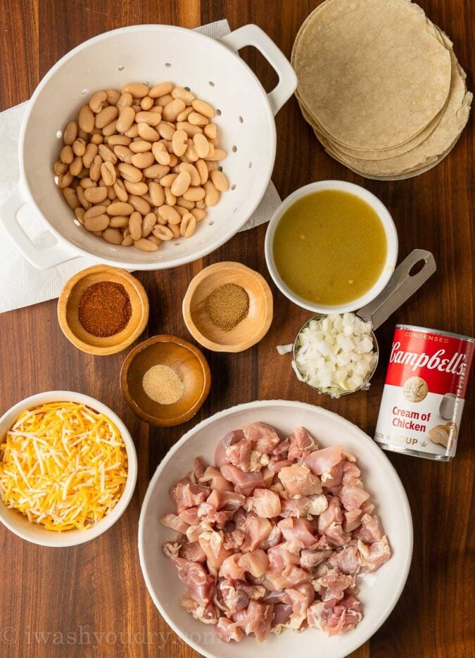 ingredients for chicken enchiladas on cutting board