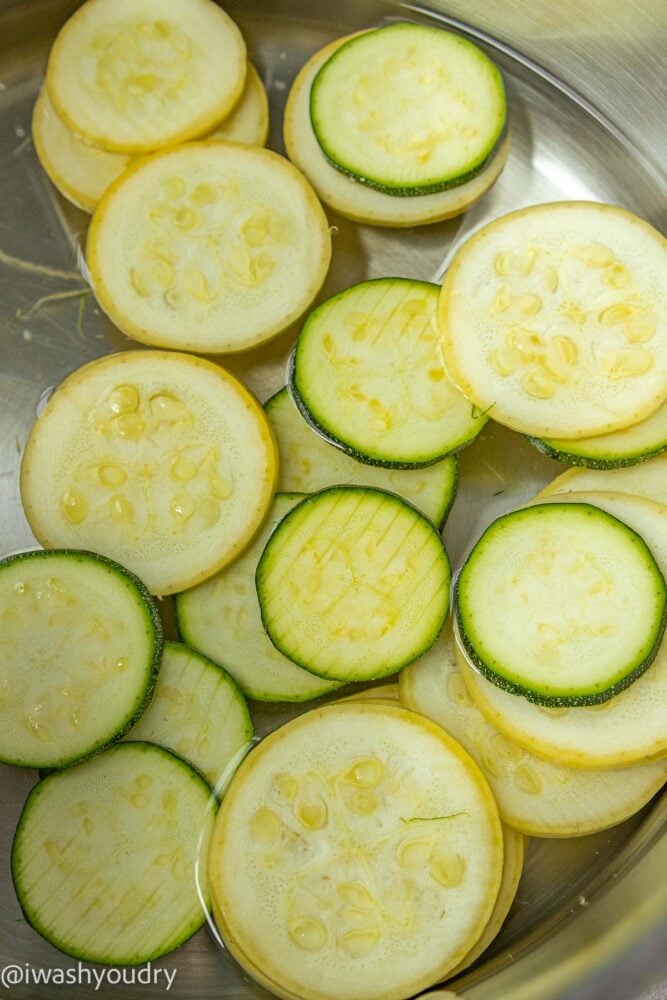 squash and zucchini slices in boiling water