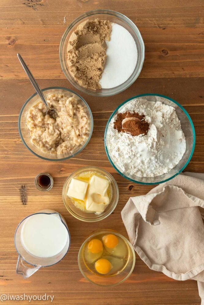 ingredients for cake on wooden surface.