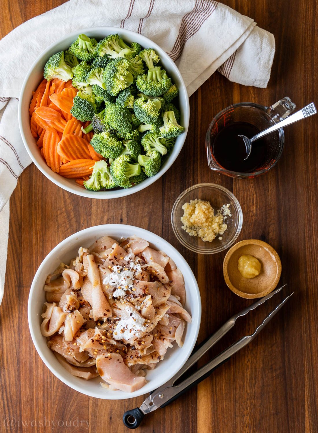 Ingredients for Broccoli Chicken stir fry on wood board.