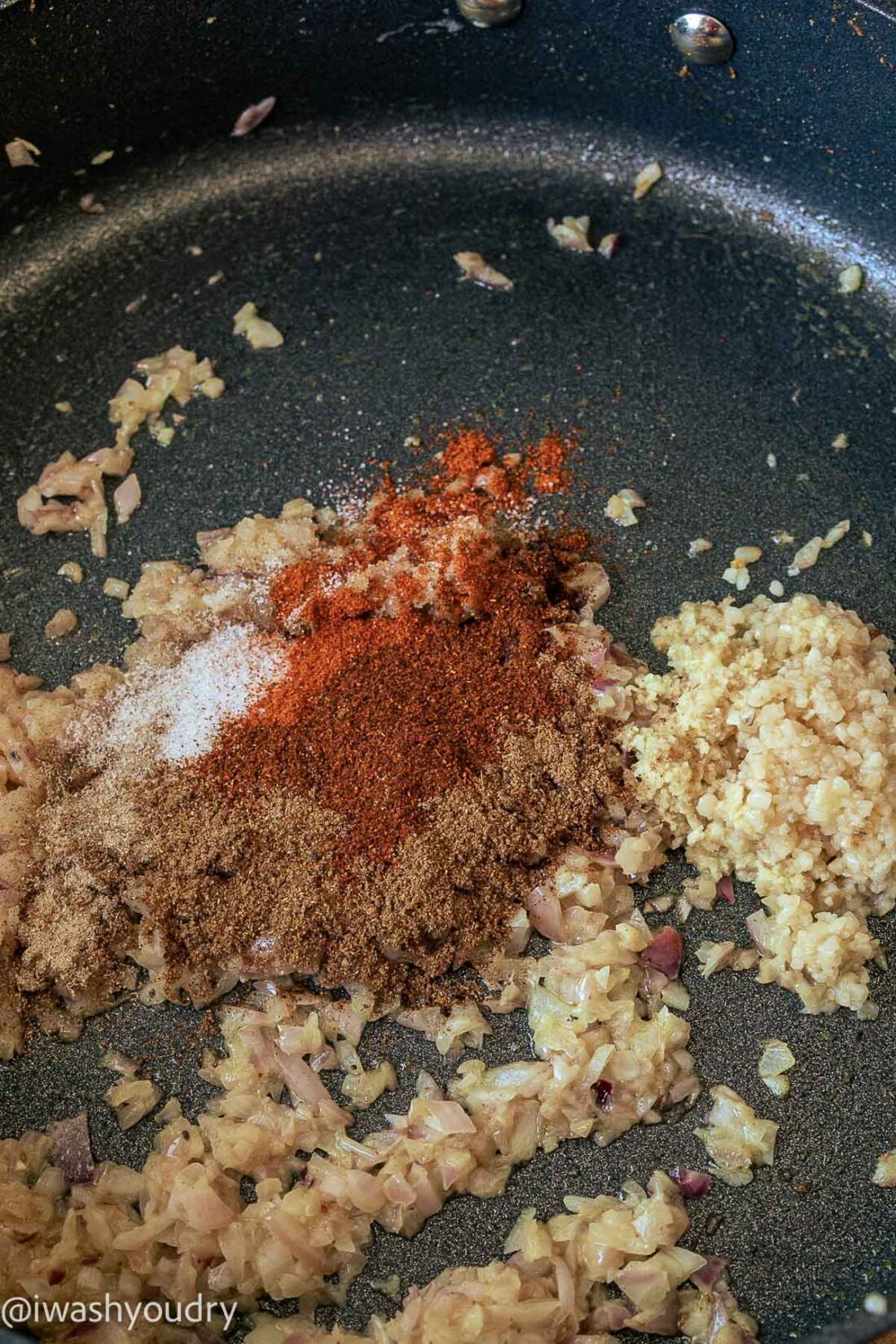 Spices for shrimp masala in frying pan