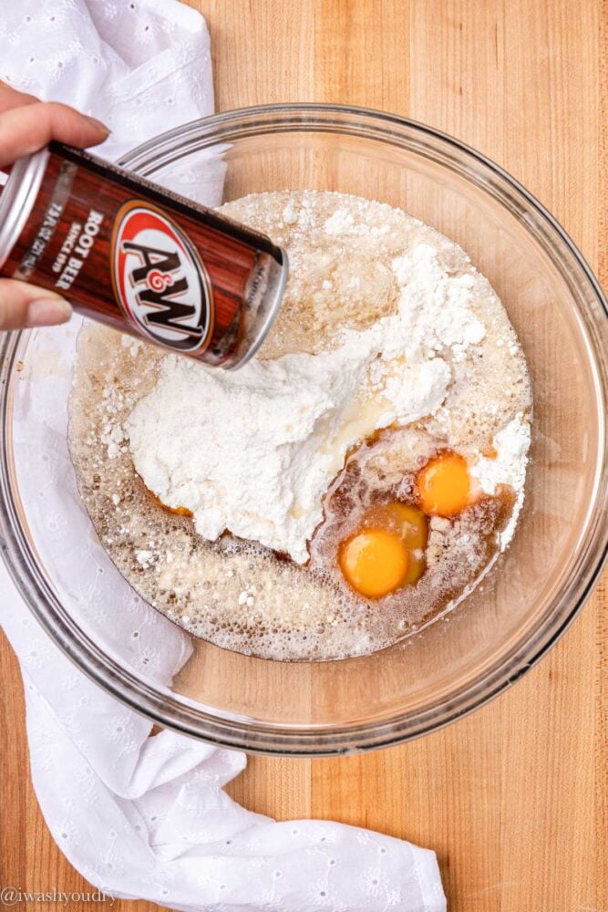 combining ingredients in bowl with root beer and eggs. 