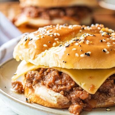 Slow Cooker Sloppy Joe with cheese slice on white plate