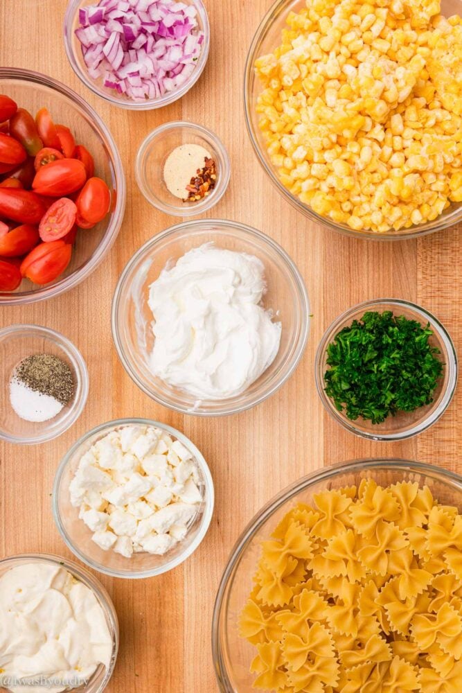 ingredients for creamy corn salad on cutting board