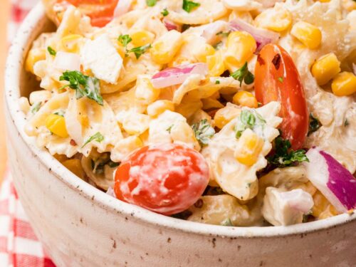 bowl of pasta salad with corn on red napkin