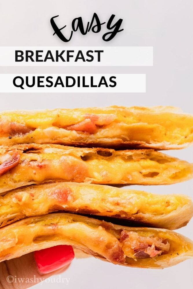 Hand holding a stack of cooked quesadillas for breakfast