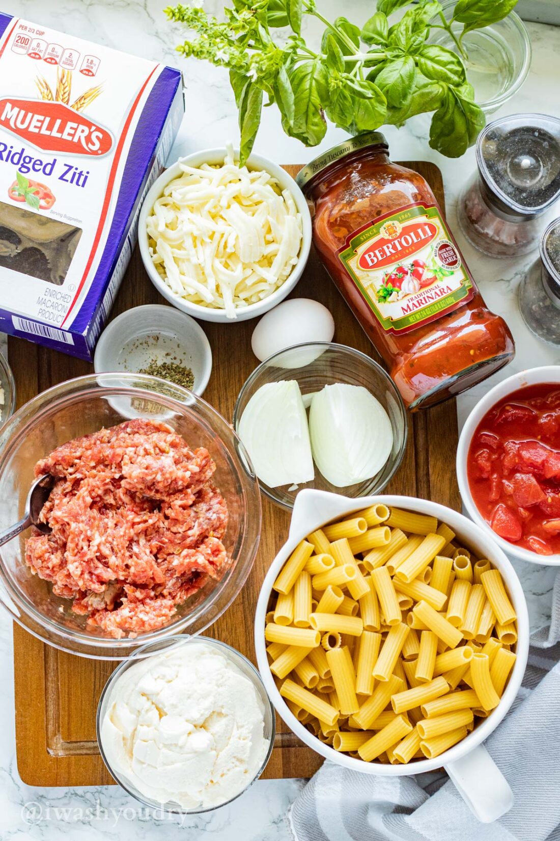 Ingredients for Slow Cooker Baked Ziti on wood cutting board
