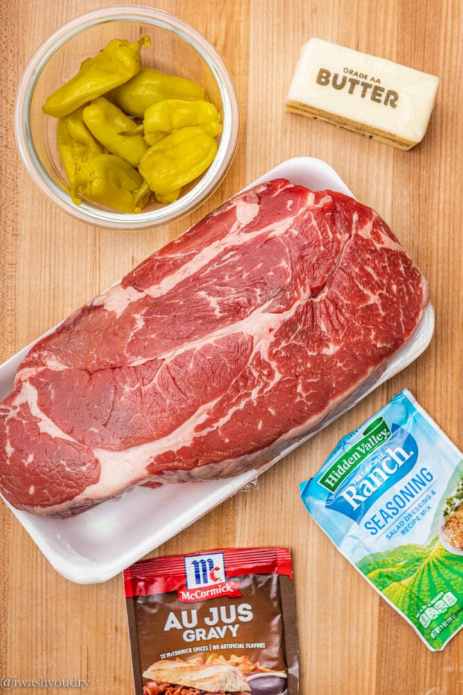 ingredients for pot roast on wooden table