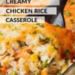 black spoon full of baked chicken and rice casserole in glass pan.
