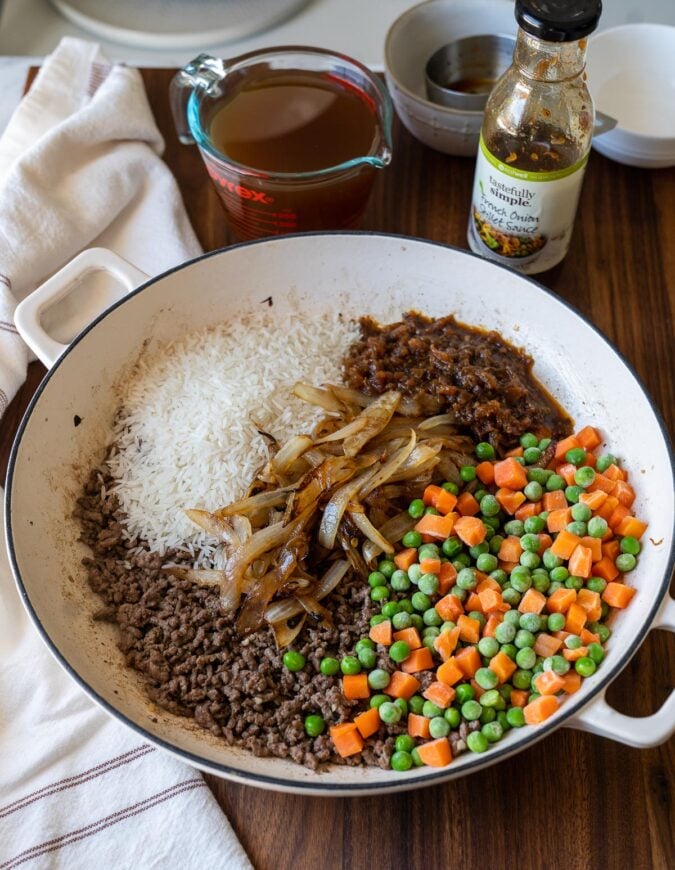 rice and ground beef in white pan with veggies