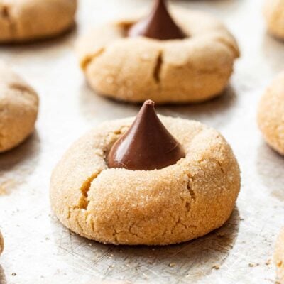 Baked Chocolate Kiss Cookies on a metal baking sheet.