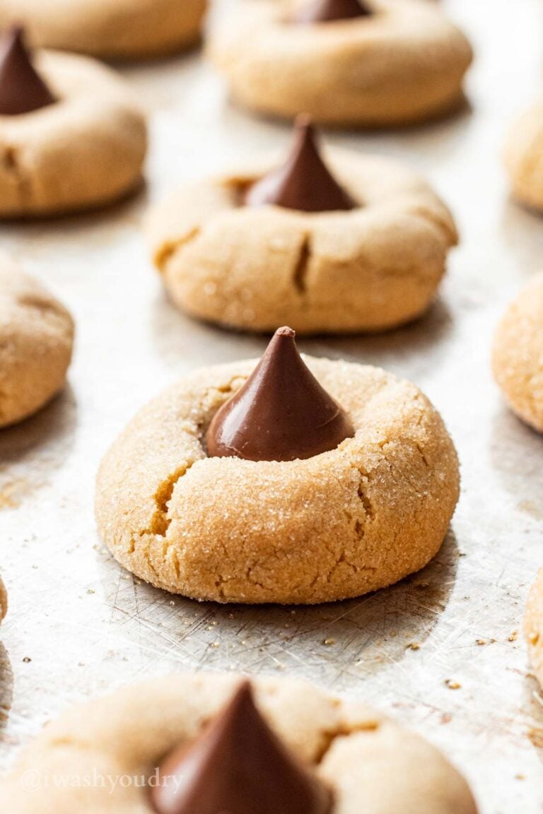 Baked Chocolate Kiss Cookies on a metal baking sheet.