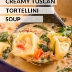 Spoonful of creamy tuscan tortellini soup above pot.