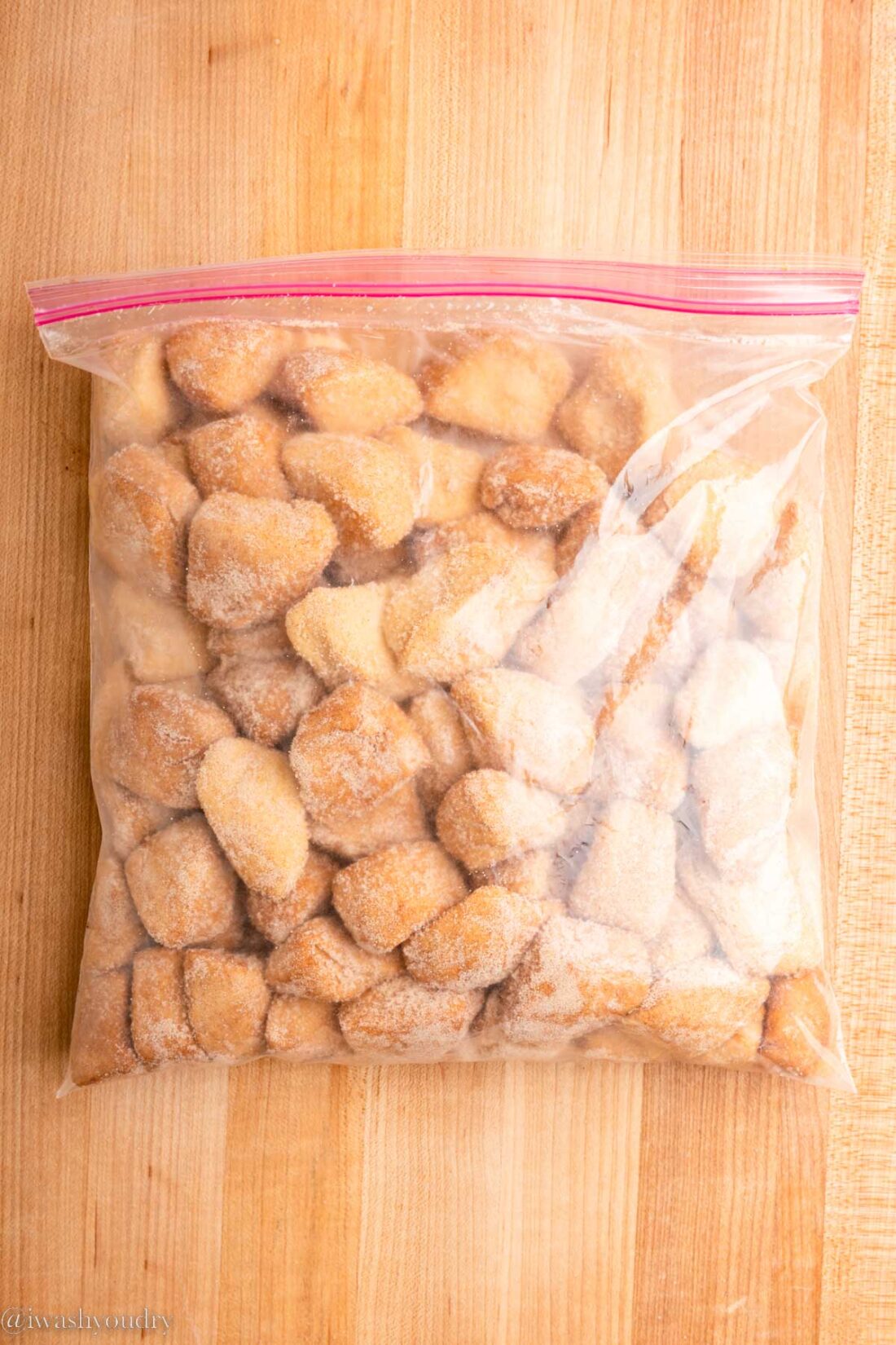 Cinnamon Sugar mixture in zip close bag with raw biscuit dough. 