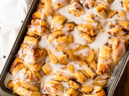 cinnamon roll bake with apples and icing for an easy breakfast.