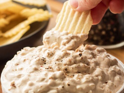 potato chip with onion chip dip on it.