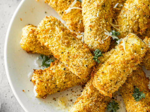 Plate of mozzarella sticks with parsley.