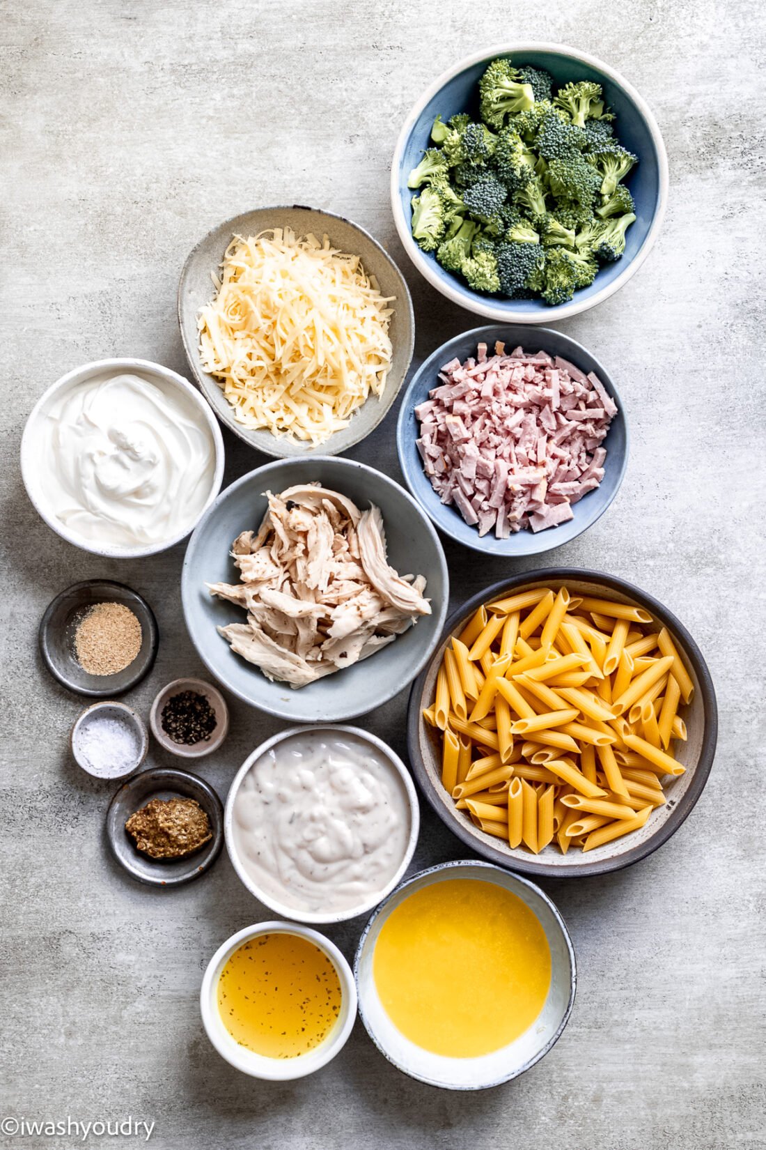 Ingredients for chicken cordon bleu in bowls on marble background