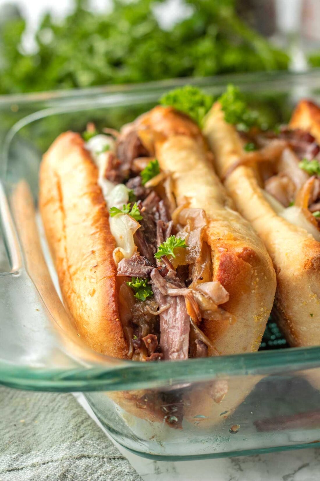 French Dip sandwich in glass pan. 